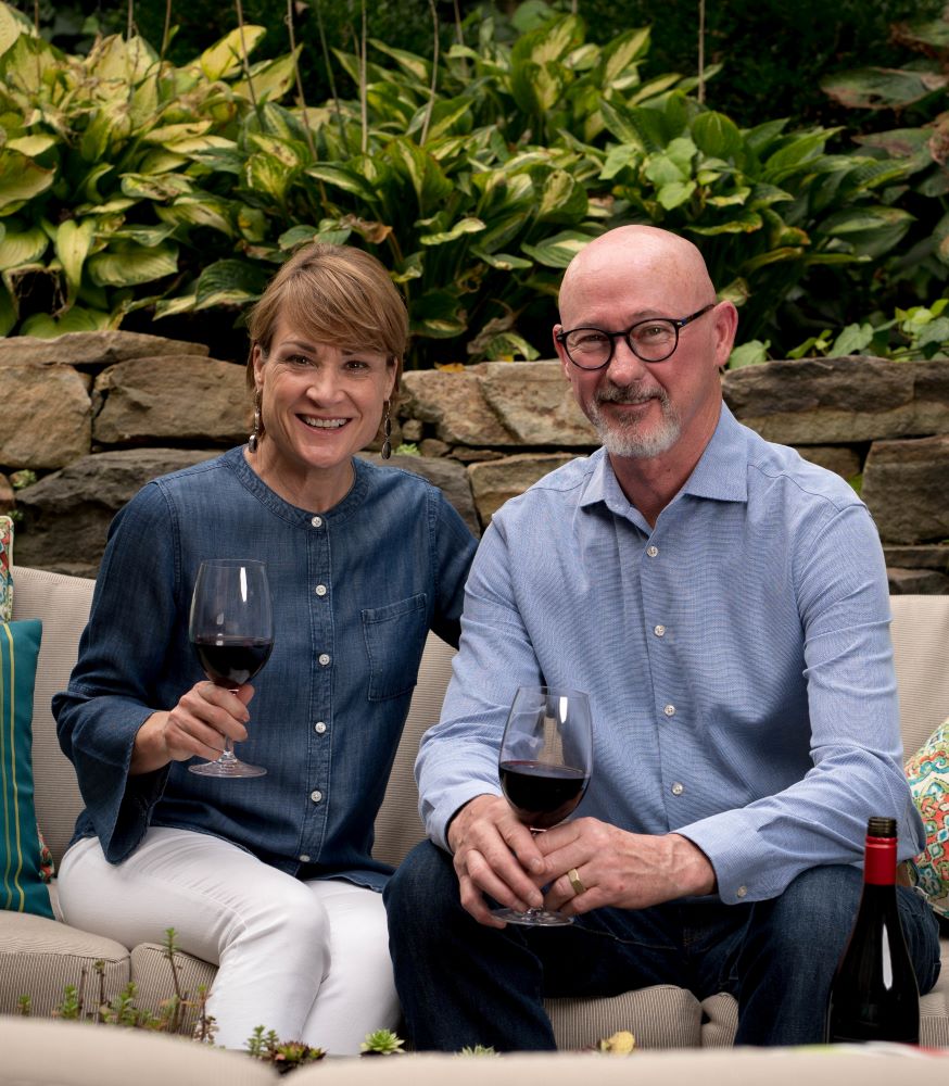 A picture of Lin and Craig holding a glass of wine